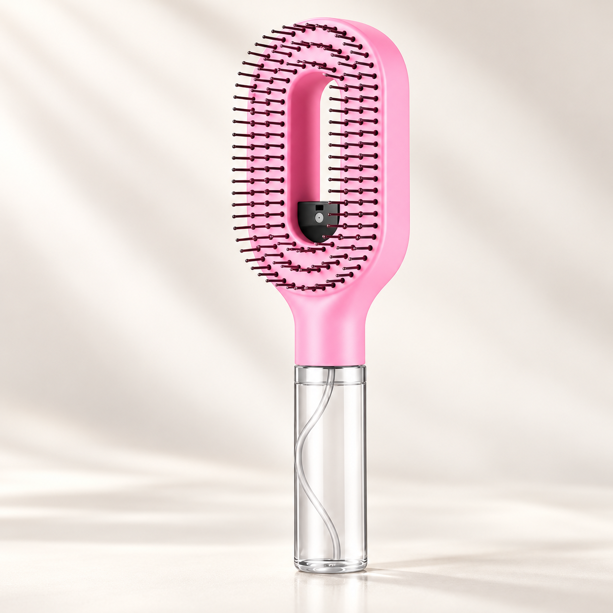 Pink spray hair comb with open-centre water reservoir